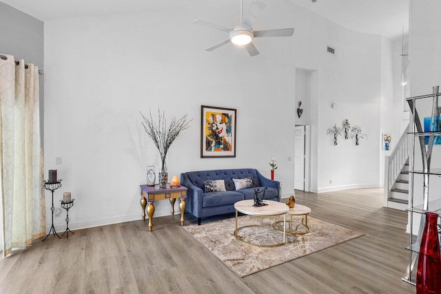 9391 Aqua Vista Blvd, Boynton Beach, FL 33437 - living area with wood finished floors, stairs, a high ceiling, ceiling fan, and baseboards