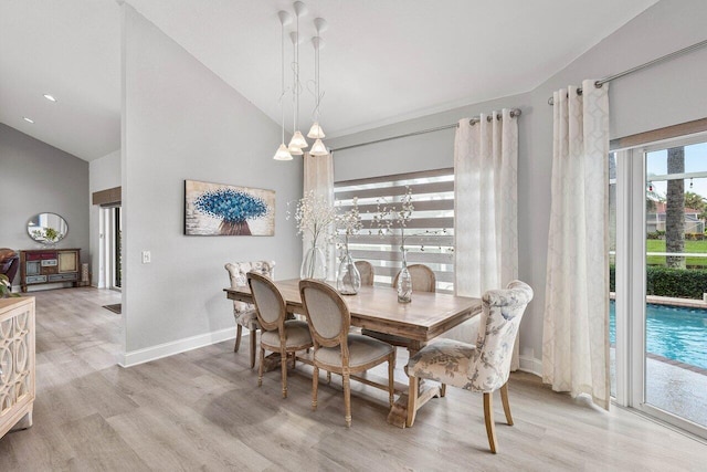9391 Aqua Vista Blvd, Boynton Beach, FL 33437 - dining area with light wood-style flooring, baseboards, and high vaulted ceiling