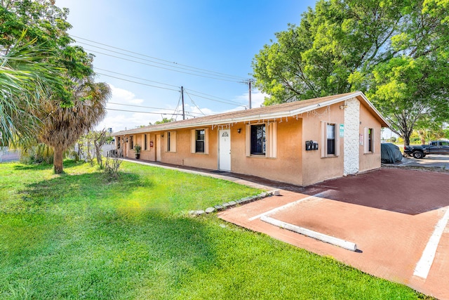 928 S H St Unit 1, Lake Worth, FL 33460 - single story home with stucco siding and a front yard