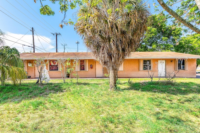 928 S H St Unit 1, Lake Worth, FL 33460 - single story home with stucco siding and a front lawn