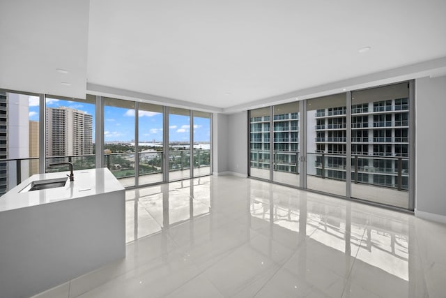 3100 N Ocean Dr Unit H-1608, Singer Island, FL 33404 - empty room featuring expansive windows, a sink, and tile patterned floors