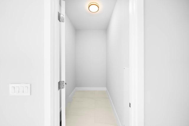3100 N Ocean Dr Unit H-1608, Singer Island, FL 33404 - hall with baseboards and light marble finish floors
