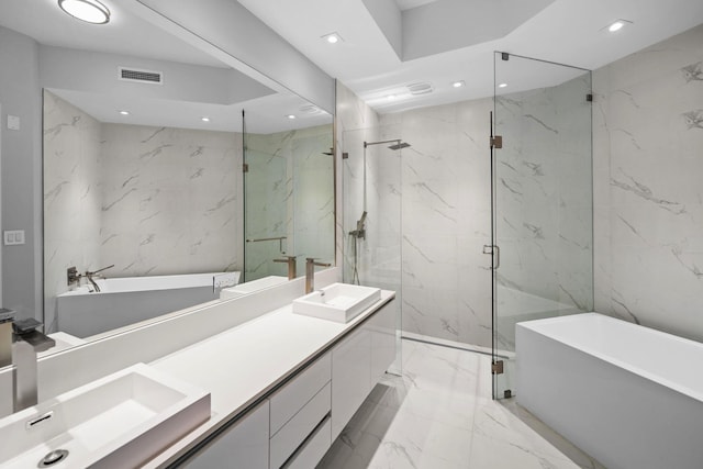 3100 N Ocean Dr Unit H-1608, Singer Island, FL 33404 - bathroom with marble tiled flooring, a freestanding tub, double vanity, a marble finish shower, and recessed lighting