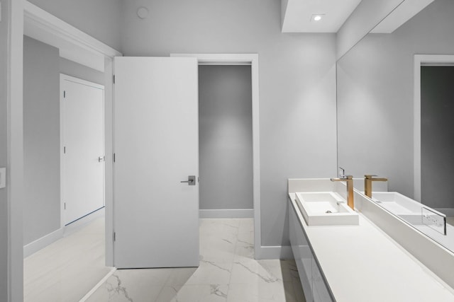 3100 N Ocean Dr Unit H-1608, Singer Island, FL 33404 - bathroom featuring baseboards, marble finish floors, vanity, and recessed lighting