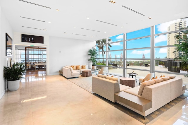 3100 N Ocean Dr Unit H-1608, Singer Island, FL 33404 - building lobby featuring a high ceiling, floor to ceiling windows, and recessed lighting