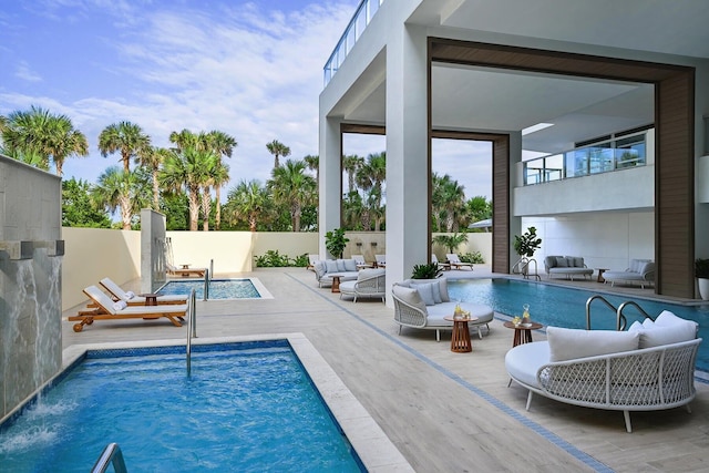 3100 N Ocean Dr Unit H-1608, Singer Island, FL 33404 - view of swimming pool with outdoor lounge area and a fenced backyard