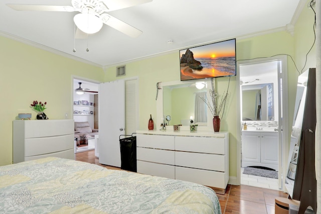 257 S Cypress Rd Unit 449, Pompano Beach, FL 33060 - bedroom with ornamental molding, ensuite bath, and wood finished floors