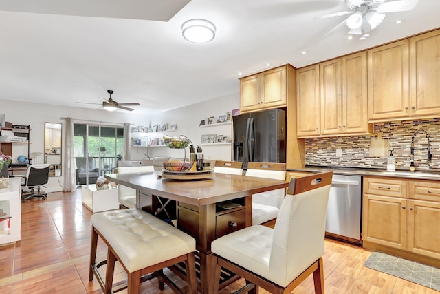 257 S Cypress Rd Unit 449, Pompano Beach, FL 33060 - kitchen featuring a ceiling fan, appliances with stainless steel finishes, a sink, backsplash, and recessed lighting