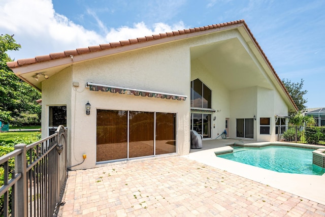 1414 SW Osprey Cv, Port Saint Lucie, FL 34986 - back of property with stucco siding and a patio
