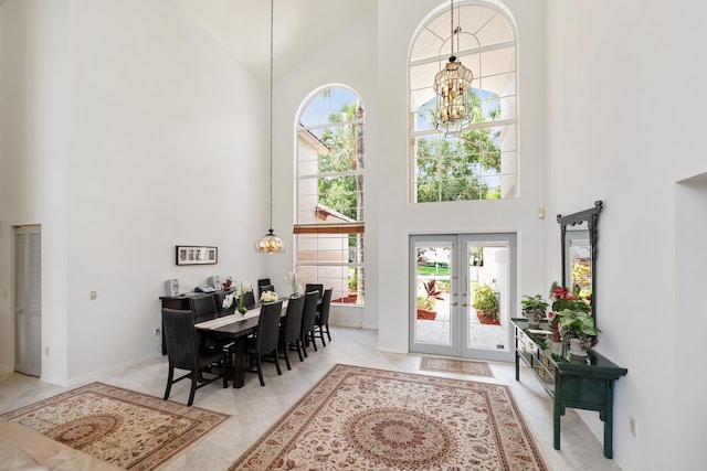 1414 SW Osprey Cv, Port Saint Lucie, FL 34986 - entryway with high vaulted ceiling, a chandelier, french doors, and baseboards