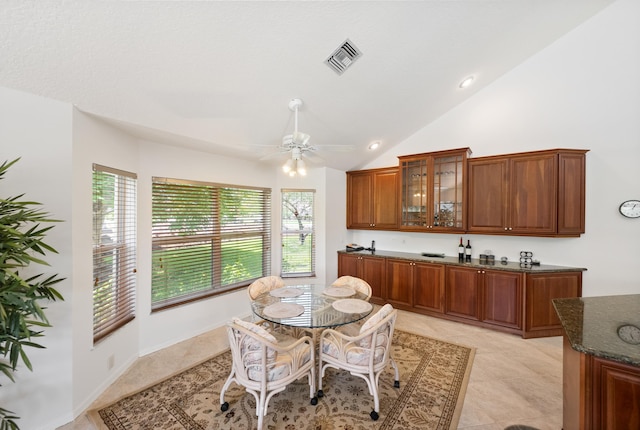 1414 SW Osprey Cv, Port Saint Lucie, FL 34986 - dining area with vaulted ceiling, a ceiling fan, and light tile patterned floors