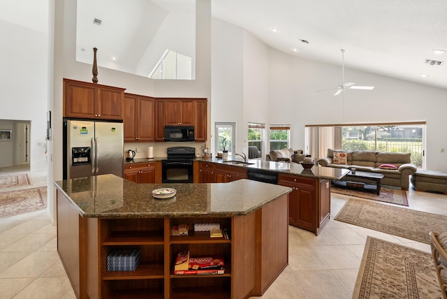 1414 SW Osprey Cv, Port Saint Lucie, FL 34986 - kitchen with black appliances, open floor plan, high vaulted ceiling, a kitchen island, and open shelves