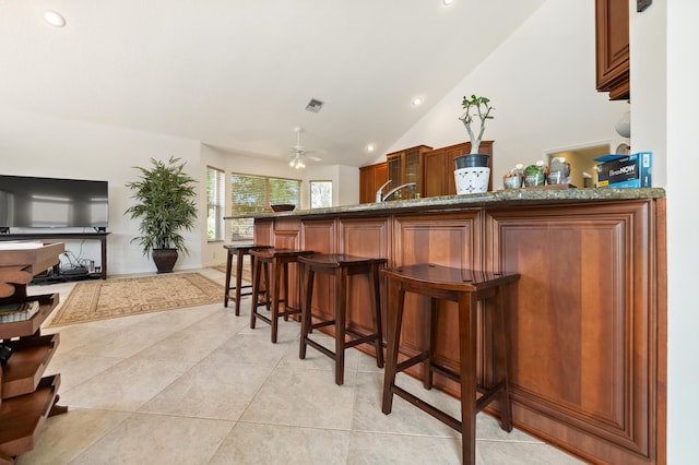 1414 SW Osprey Cv, Port Saint Lucie, FL 34986 - bar area featuring recessed lighting, vaulted ceiling, light tile patterned floors, and a ceiling fan