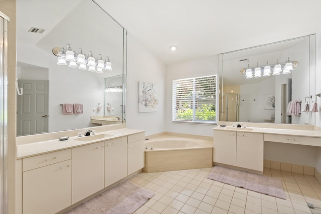 1414 SW Osprey Cv, Port Saint Lucie, FL 34986 - bathroom with a shower stall, a bath, two vanities, tile patterned flooring, and lofted ceiling