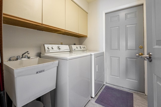 1414 SW Osprey Cv, Port Saint Lucie, FL 34986 - laundry area with cabinet space and washing machine and clothes dryer