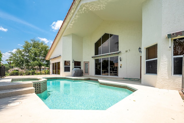 1414 SW Osprey Cv, Port Saint Lucie, FL 34986 - view of swimming pool featuring a patio and a pool with connected hot tub