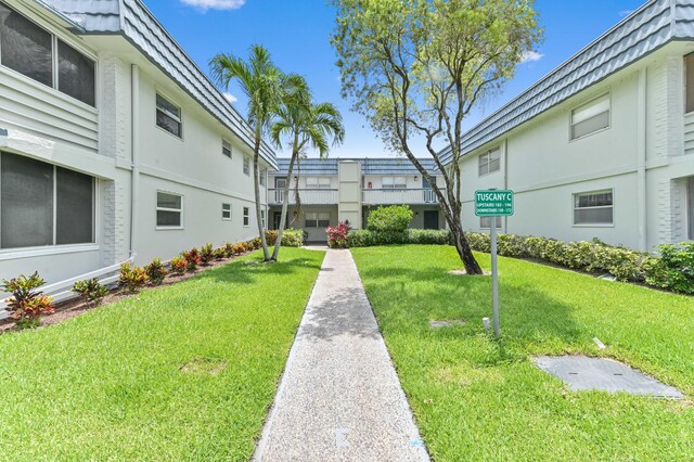 160 Tuscany C, Delray Beach, FL 33446 - view of home's community with a lawn