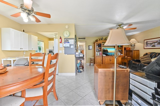 160 Tuscany C, Delray Beach, FL 33446 - kitchen featuring ceiling fan, white cabinetry, light tile patterned floors, and baseboards