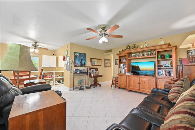 160 Tuscany C, Delray Beach, FL 33446 - living room featuring ceiling fan, light tile patterned floors, and baseboards