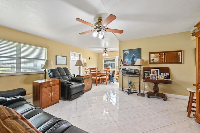 160 Tuscany C, Delray Beach, FL 33446 - living room with a ceiling fan, baseboards, and light tile patterned flooring