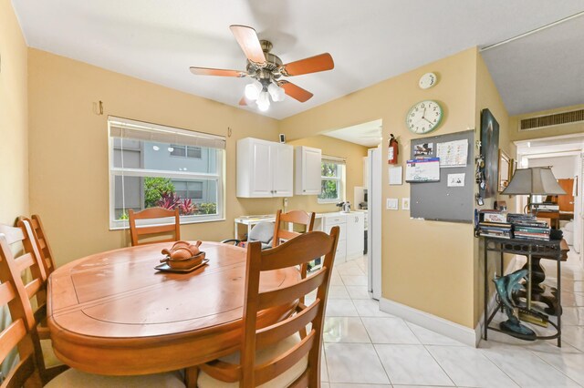 160 Tuscany C, Delray Beach, FL 33446 - dining space featuring light tile patterned floors, ceiling fan, and baseboards