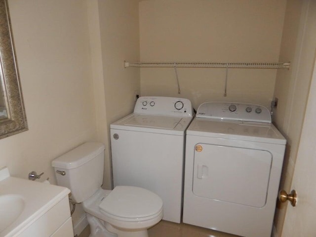 3721 37th Way, West Palm Beach, FL 33407 - half bathroom featuring washer and dryer, vanity, and toilet