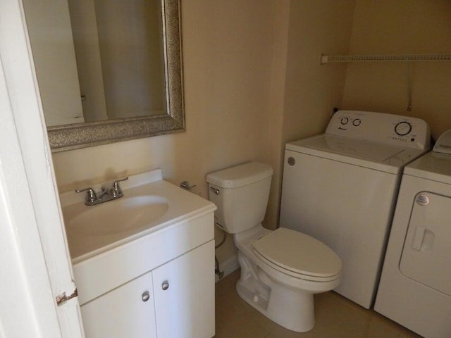 3721 37th Way, West Palm Beach, FL 33407 - bathroom featuring washer and dryer, vanity, and toilet