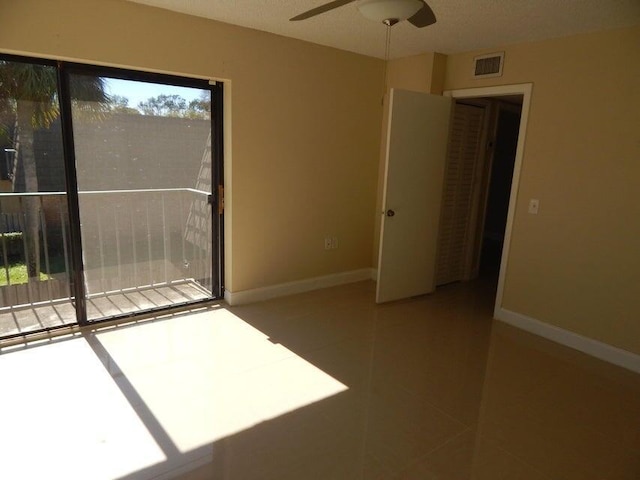 3721 37th Way, West Palm Beach, FL 33407 - spare room featuring light tile patterned floors, ceiling fan, and baseboards
