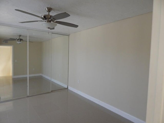 3721 37th Way, West Palm Beach, FL 33407 - unfurnished bedroom with baseboards, tile patterned floors, ceiling fan, and a closet