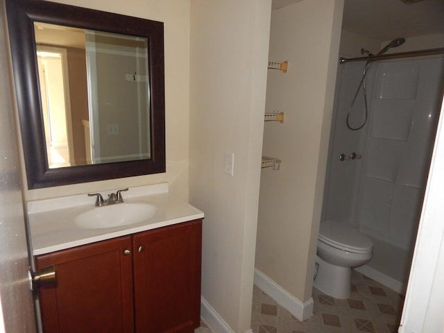3721 37th Way, West Palm Beach, FL 33407 - bathroom featuring vanity, toilet, a shower, and baseboards