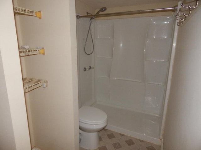 3721 37th Way, West Palm Beach, FL 33407 - bathroom featuring a shower, toilet, and tile patterned floors