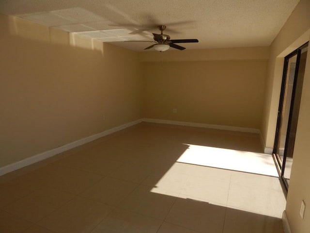 3721 37th Way, West Palm Beach, FL 33407 - tiled spare room featuring a ceiling fan, a textured ceiling, and baseboards