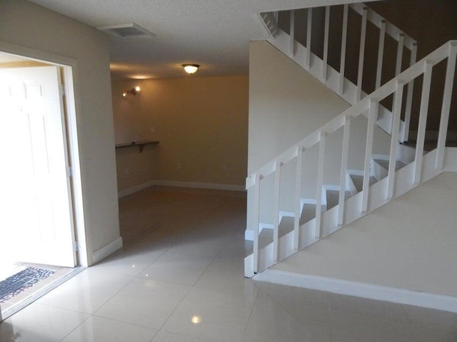 3721 37th Way, West Palm Beach, FL 33407 - stairway featuring baseboards and tile patterned flooring