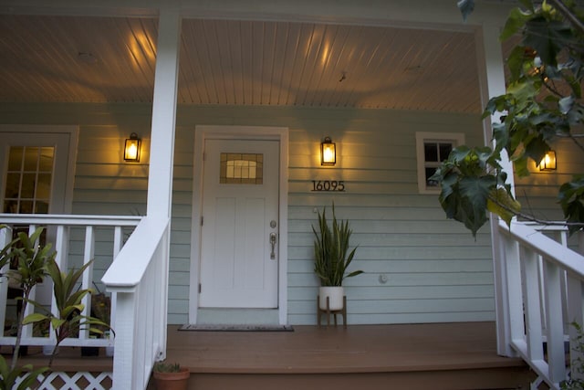 16095 121st Ter N, Jupiter, FL 33478 - doorway to property with covered porch