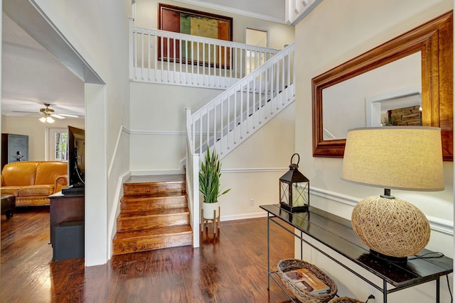 16095 121st Ter N, Jupiter, FL 33478 - stairway with wood finished floors, ceiling fan, ornamental molding, and baseboards