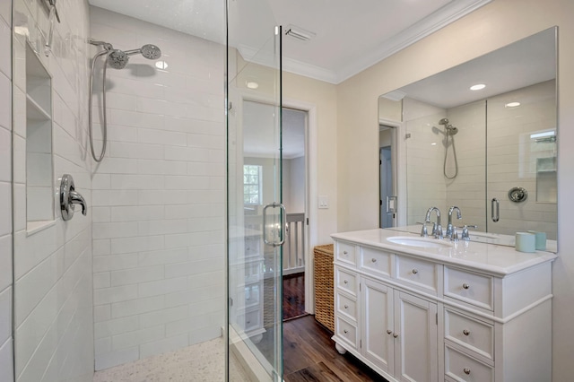 16095 121st Ter N, Jupiter, FL 33478 - full bath featuring a stall shower, vanity, ornamental molding, and wood finished floors