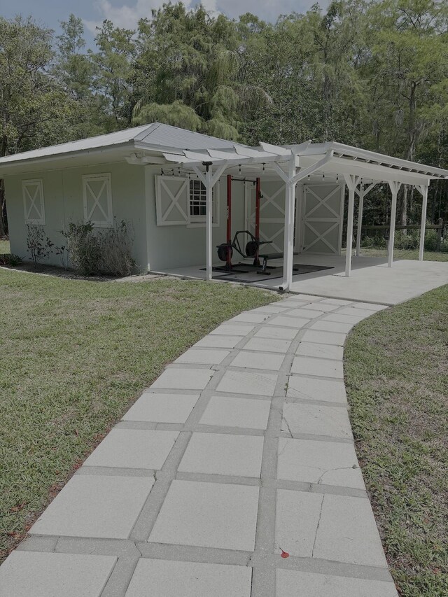16095 121st Ter N, Jupiter, FL 33478 - view of outdoor structure with view of wooded area