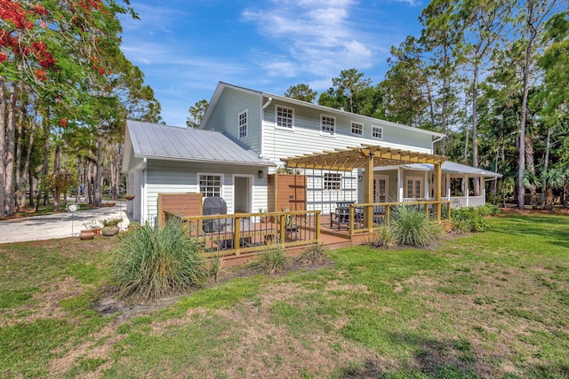 16095 121st Ter N, Jupiter, FL 33478 - rear view of house featuring a pergola, a yard, a deck, and metal roof