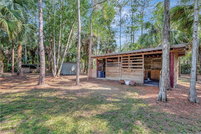 16095 121st Ter N, Jupiter, FL 33478 - view of yard with an outdoor structure and an exterior structure