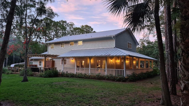 16095 121st Ter N, Jupiter, FL 33478 - view of front of home featuring a front lawn and metal roof