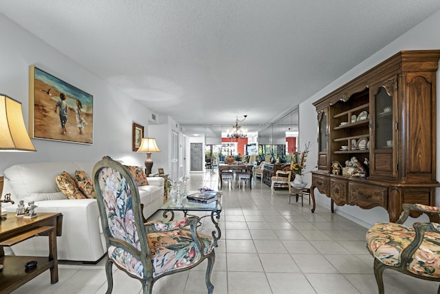 5153 Oak Hill Ln Unit 512, Delray Beach, FL 33484 - living area with a chandelier, a textured ceiling, and light tile patterned floors