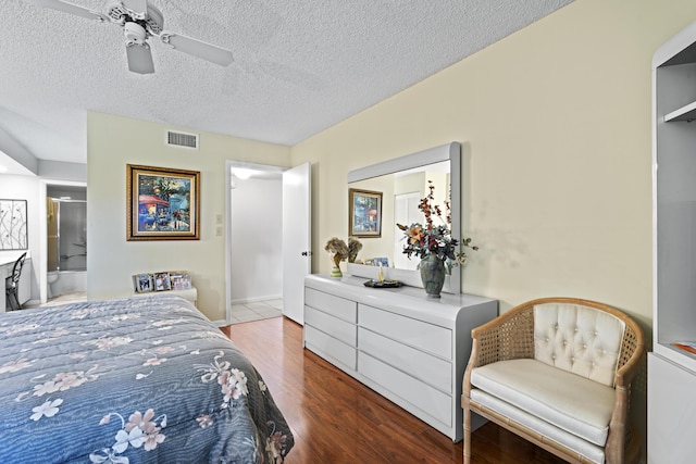 5153 Oak Hill Ln Unit 512, Delray Beach, FL 33484 - bedroom with wood finished floors, a textured ceiling, a ceiling fan, and ensuite bathroom