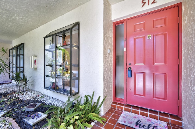 5153 Oak Hill Ln Unit 512, Delray Beach, FL 33484 - view of exterior entry with stucco siding