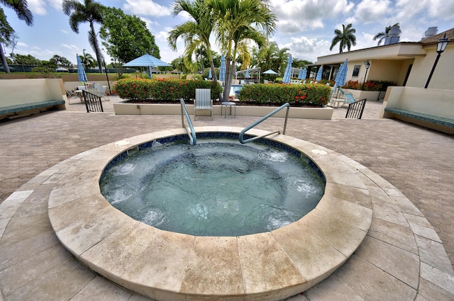 5153 Oak Hill Ln Unit 512, Delray Beach, FL 33484 - view of pool featuring a patio area and a community hot tub