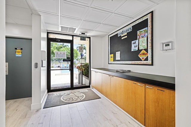 5153 Oak Hill Ln Unit 512, Delray Beach, FL 33484 - doorway with floor to ceiling windows and light wood-style flooring