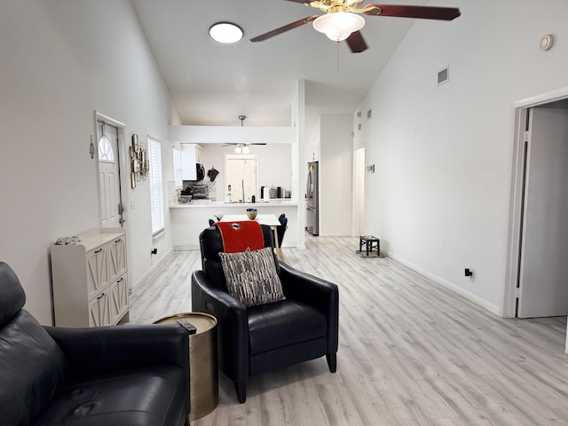 1518 Royal Forest Ct, Palm Springs, FL 33406 - living area featuring ceiling fan, light wood-style floors, and high vaulted ceiling