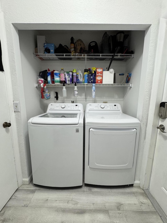 1518 Royal Forest Ct, Palm Springs, FL 33406 - laundry area featuring separate washer and dryer and light wood-type flooring