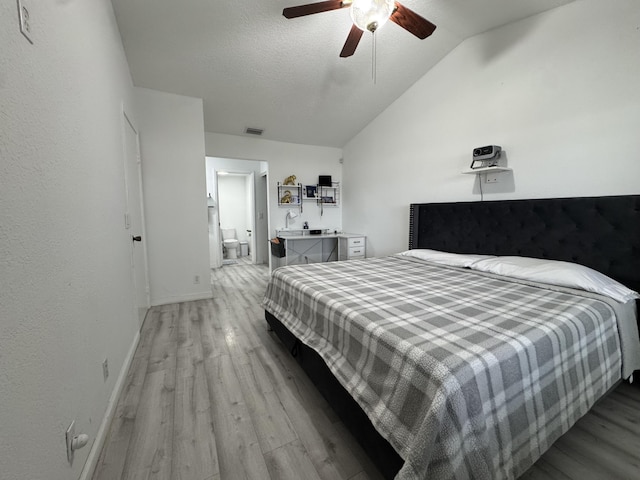 1518 Royal Forest Ct, Palm Springs, FL 33406 - bedroom featuring light wood-type flooring, lofted ceiling, baseboards, ensuite bathroom, and ceiling fan