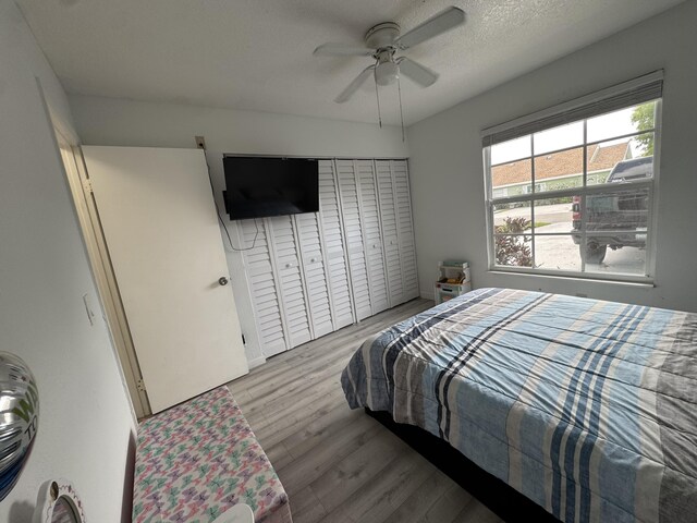 1518 Royal Forest Ct, Palm Springs, FL 33406 - bedroom with wood finished floors, a closet, and a ceiling fan