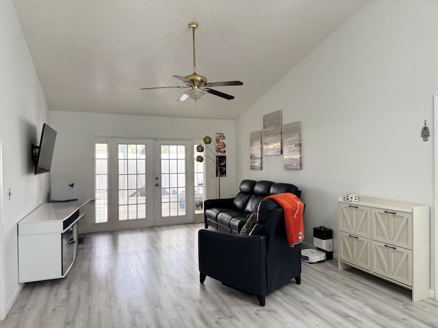 1518 Royal Forest Ct, Palm Springs, FL 33406 - living area with french doors, light wood-type flooring, a ceiling fan, vaulted ceiling, and baseboards